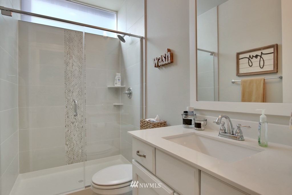 317 Field Place Southeast Renton, WA 98059 - Photo 5 of 29 a bathroom with a sink toilet and shower