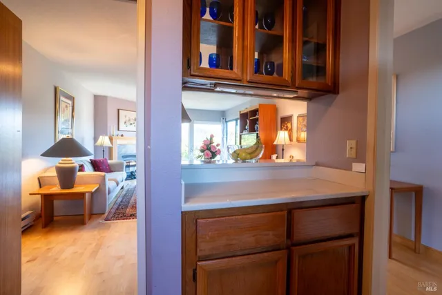 view of living room kitchen with furniture and a window
