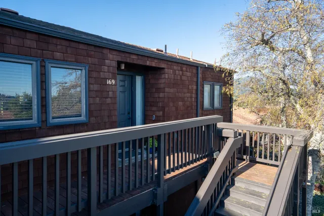 a view of a wooden house with a large window