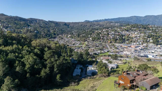 an aerial view of a house with a lake view
