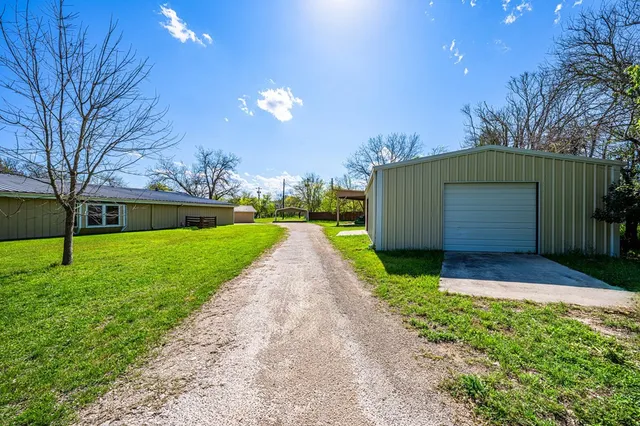 a view of a back yard of the house