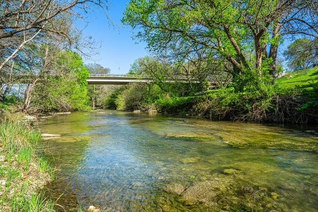 a view of pool with a yard