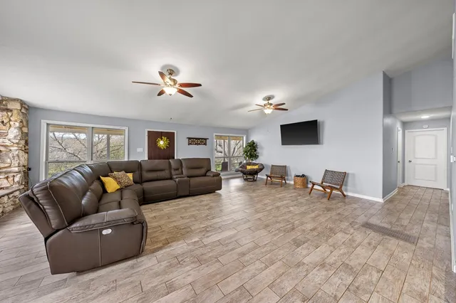a living room with furniture and a flat screen tv