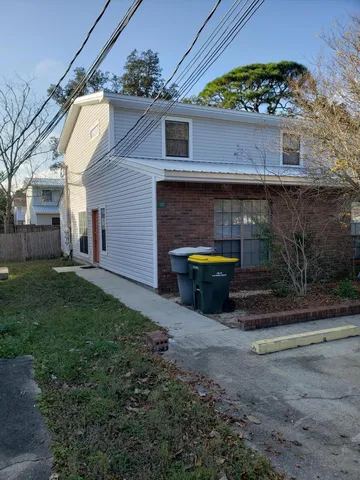 a view of a house with a sink and yard