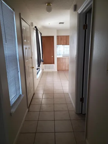 a view of entryway with stairs and a shower