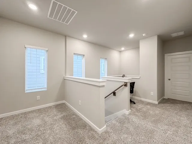 a view of a kitchen with a sink and dishwasher cabinet with wooden floor