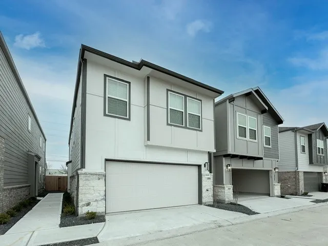 a front view of a house with a garage