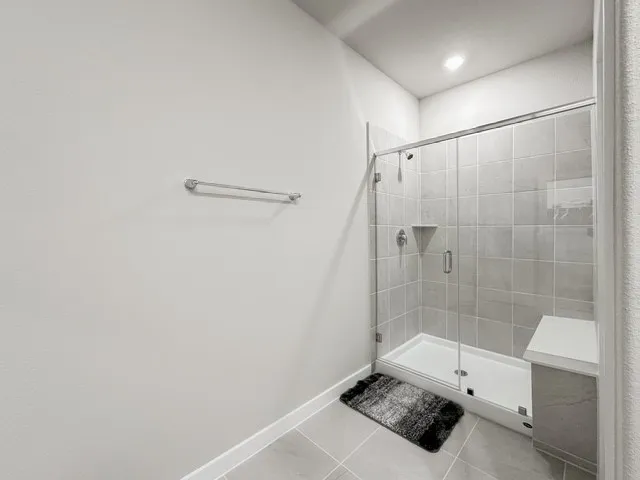 a bathroom with a shower and a toilet