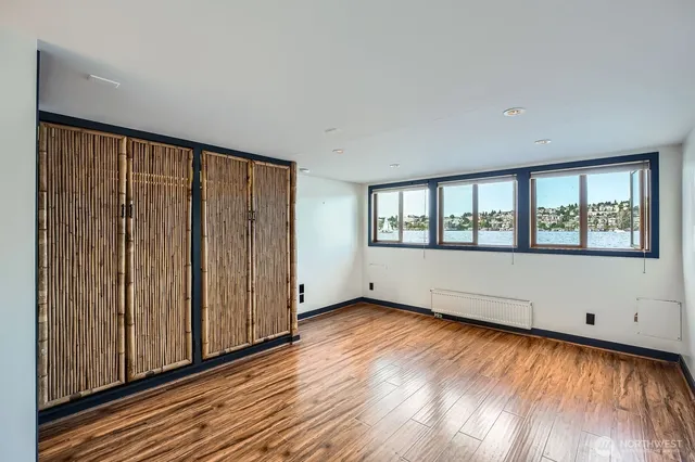 a view of room with wooden floor