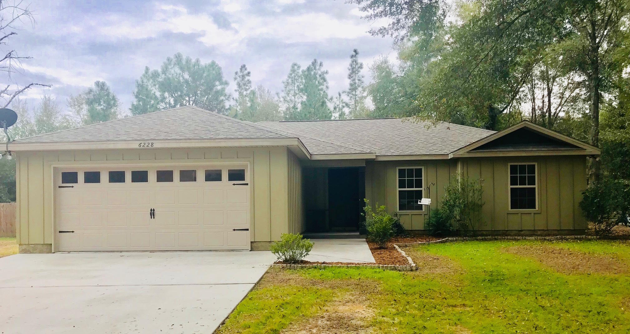 6228 Winstead Road Crestview, FL 32539 - Photo 1 of 2 a view of a house with a yard