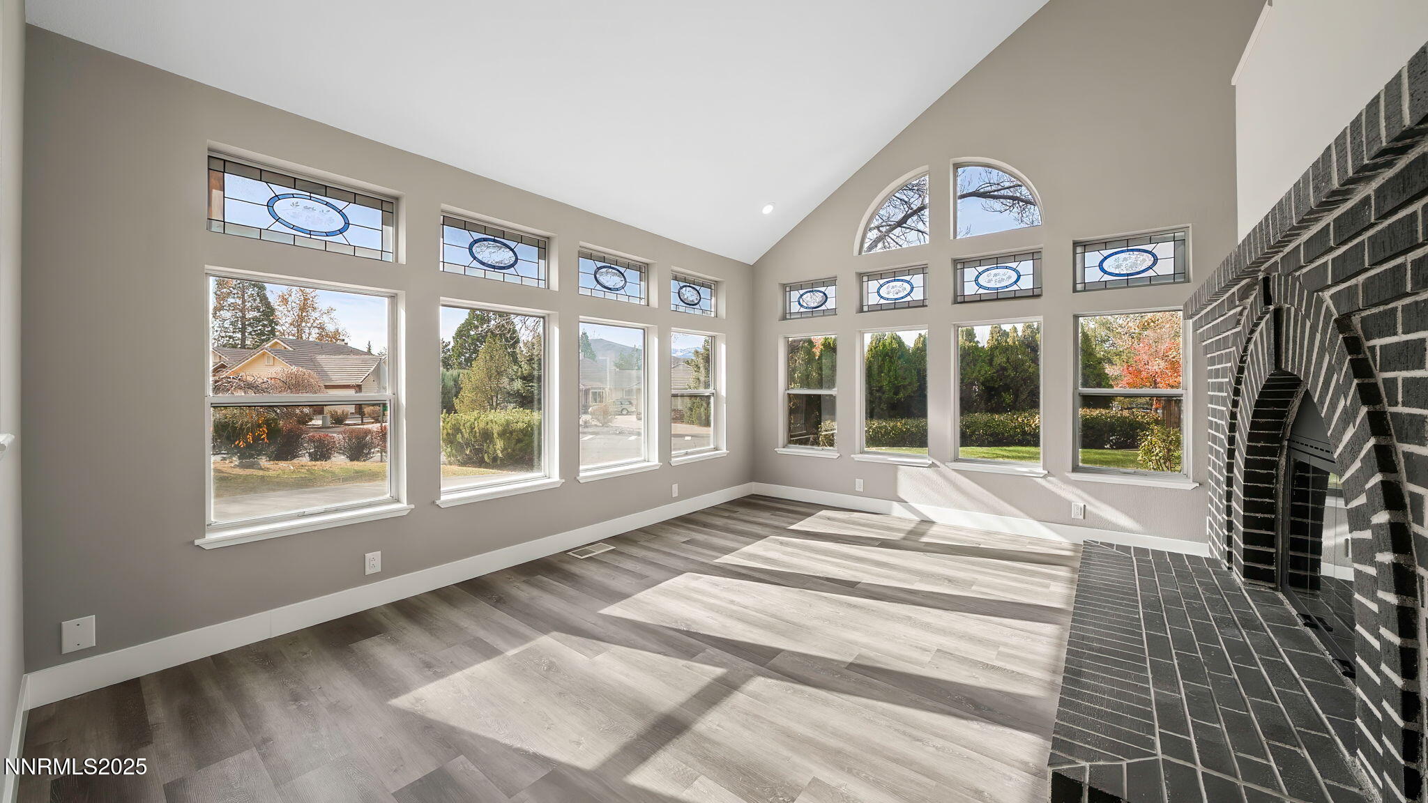 5700 East Hidden Valley Drive Reno, NV 89502 - Photo 25 of 91 a view of an entryway with a floor to ceiling window and a flat screen tv