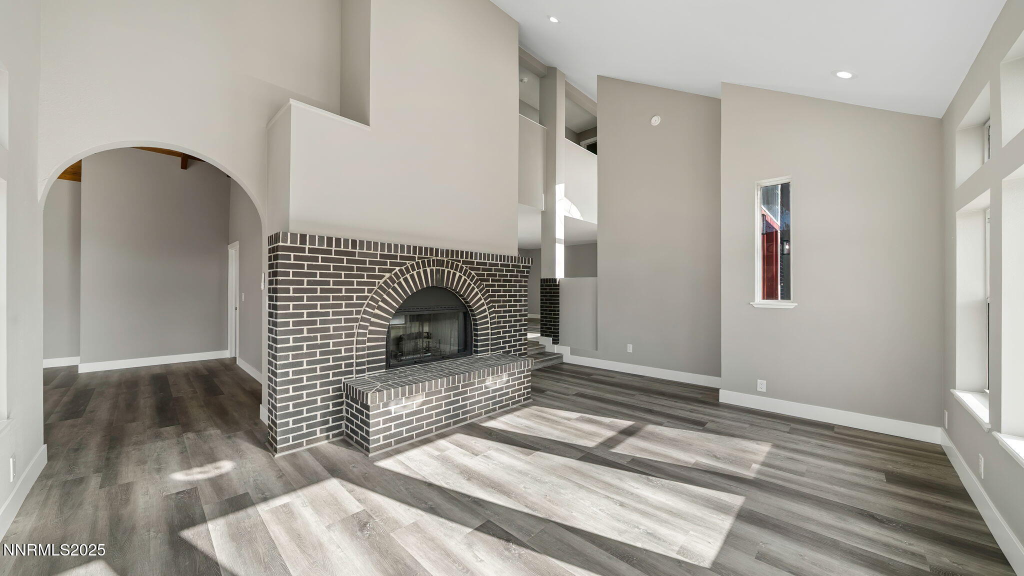 5700 East Hidden Valley Drive Reno, NV 89502 - Photo 27 of 91 a view of a livingroom with wooden floor and staircase