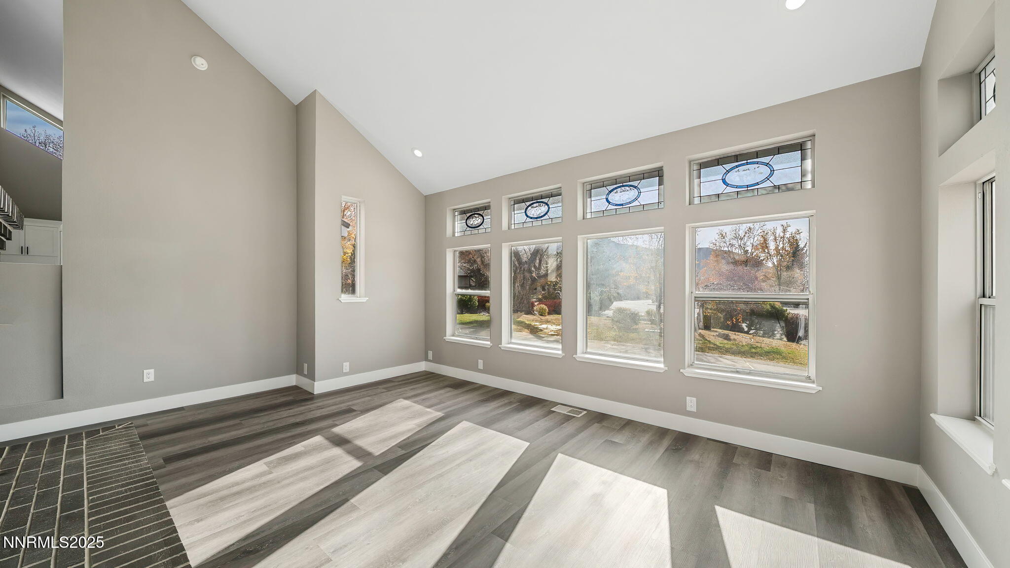 5700 East Hidden Valley Drive Reno, NV 89502 - Photo 28 of 91 a view of an empty room with wooden floor and a window