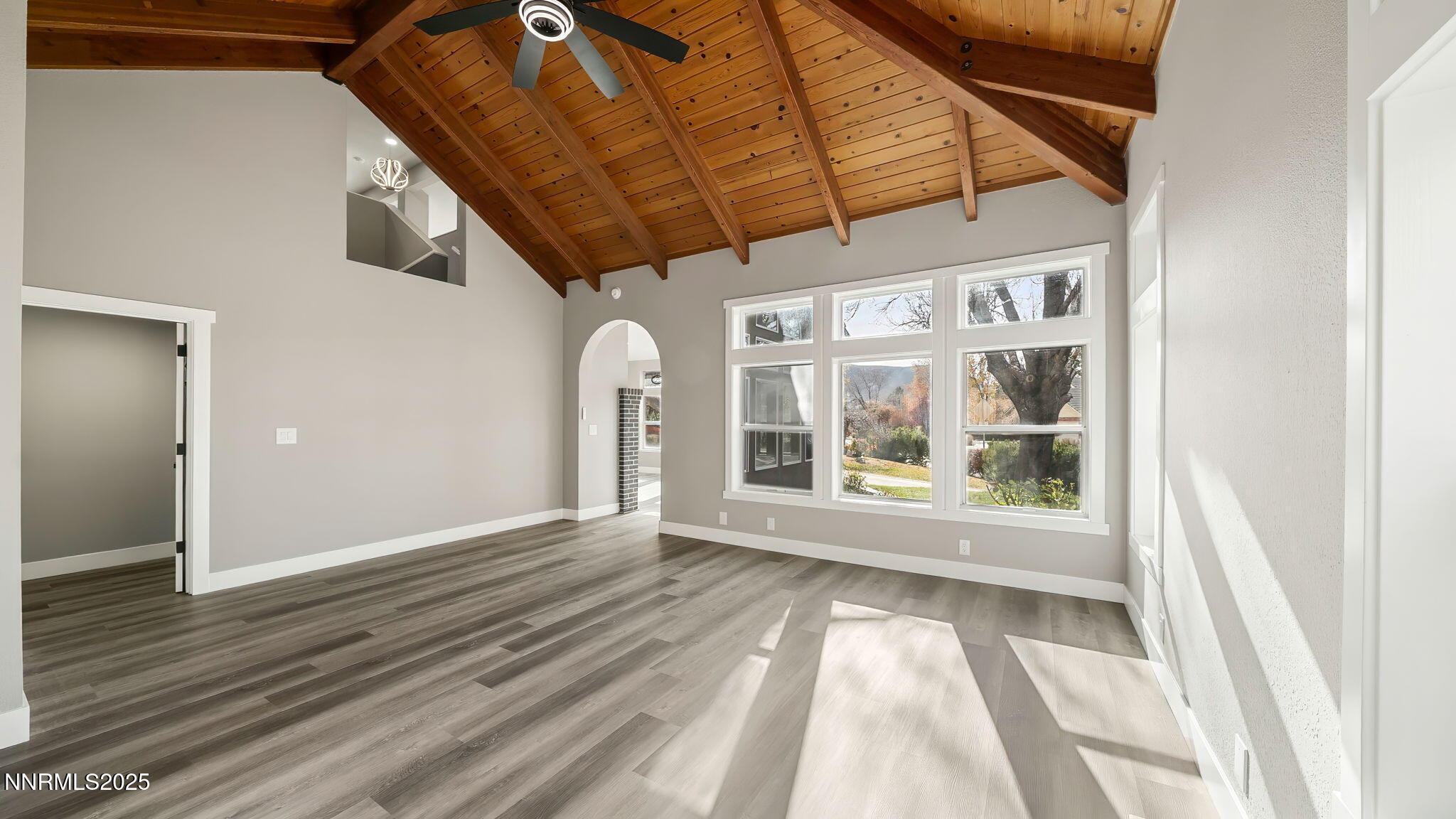 5700 East Hidden Valley Drive Reno, NV 89502 - Photo 3 of 91 a view of empty room with wooden floor and fan