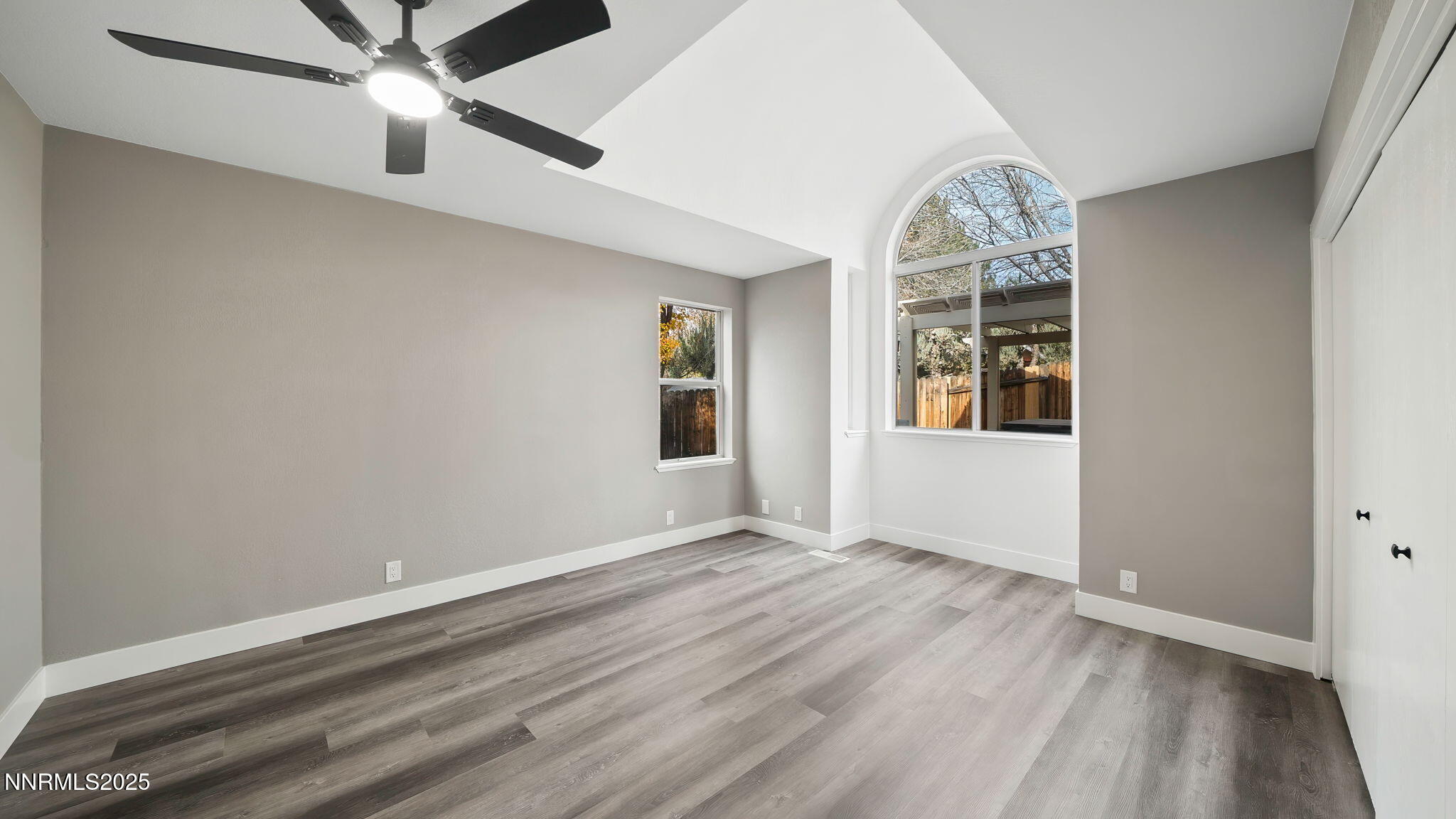 5700 East Hidden Valley Drive Reno, NV 89502 - Photo 48 of 91 an empty room with wooden floor fan and windows