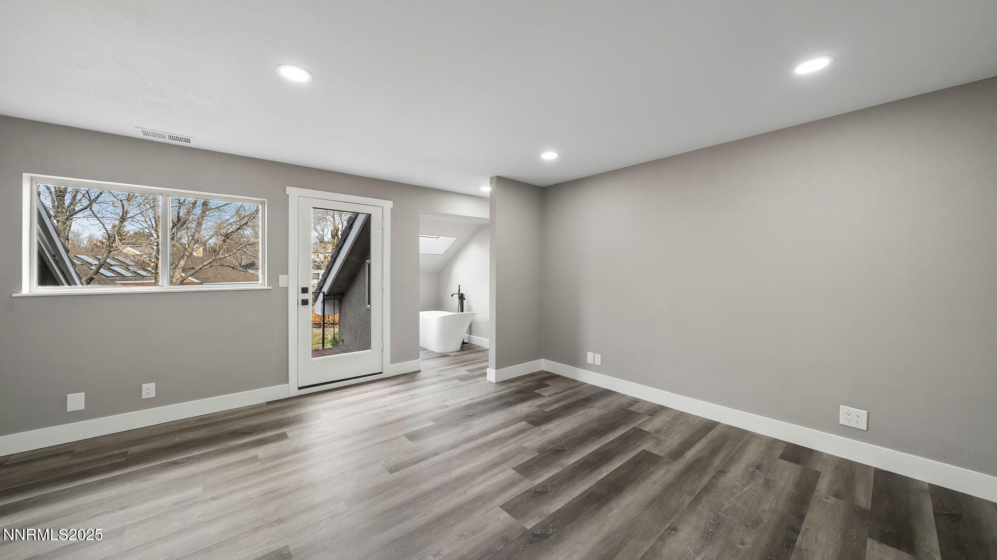 5700 East Hidden Valley Drive Reno, NV 89502 - Photo 56 of 91 a view of empty room with wooden floor and fan