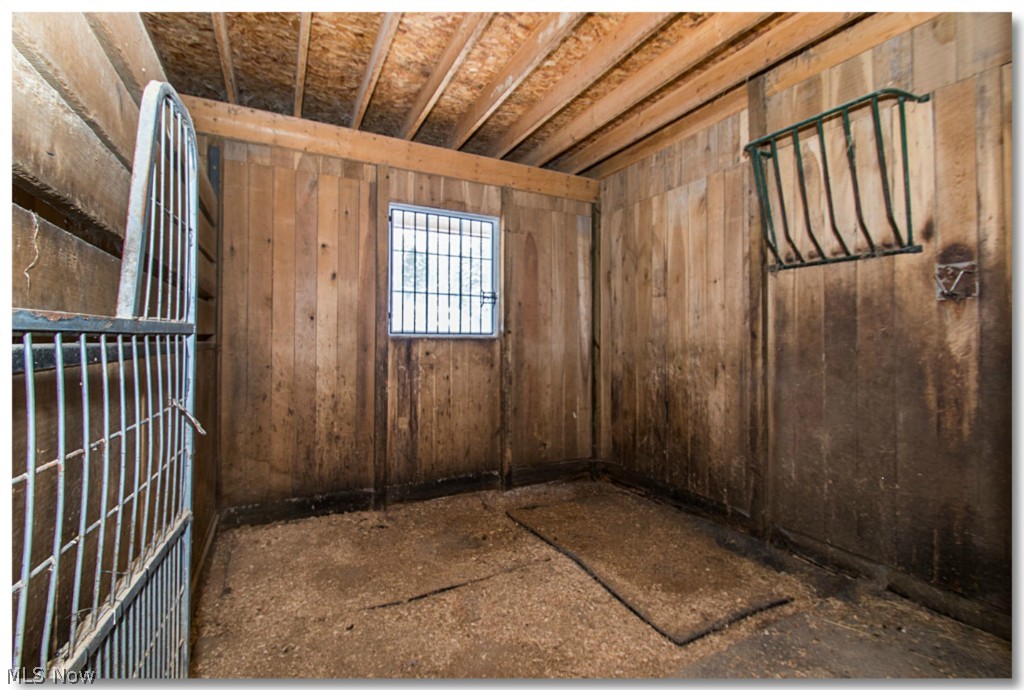 7901 Cedar Road Chesterland, OH 44026 - Photo 20 of 25 Matted stalls with hay racks, windows that open for ventilation.