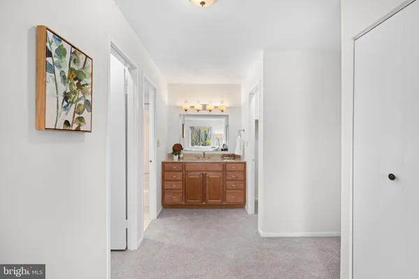 a view of a room with shelf on the wall