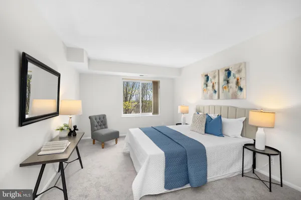 a bathroom with a shower curtain and a toilet