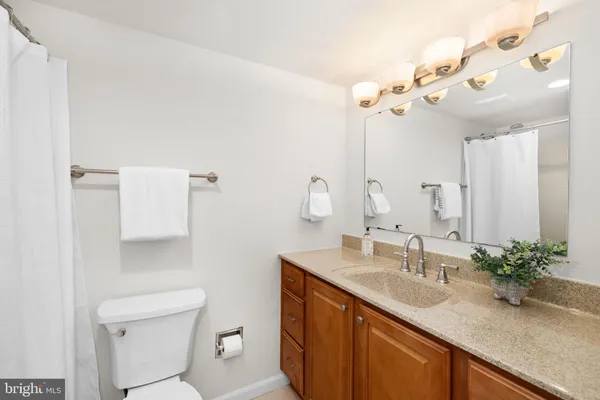 a bedroom with a bed and chair