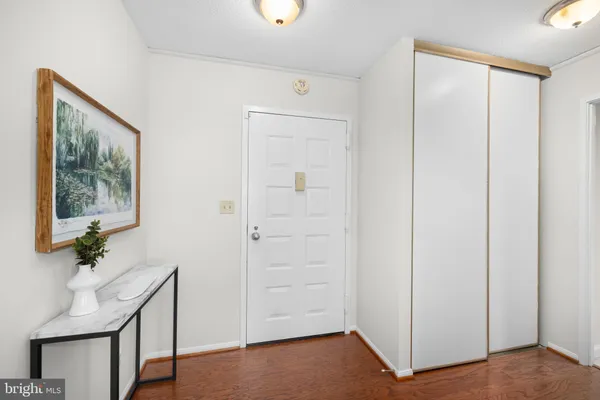 a bathroom with a granite countertop sink a toilet and mirror
