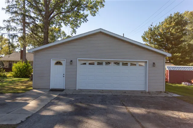 a front view of house with garage
