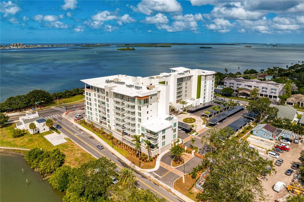 1020 Sunset Point Road, Unit 213 Clearwater, FL 33755 - Photo 2 of 42 a view of a lake with a building in the background