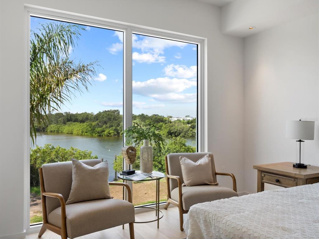 1020 Sunset Point Road, Unit 213 Clearwater, FL 33755 - Photo 24 of 42 a living room with furniture and a large window