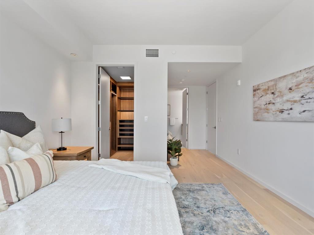 1020 Sunset Point Road, Unit 213 Clearwater, FL 33755 - Photo 27 of 42 a bedroom with a large bed and bedroom