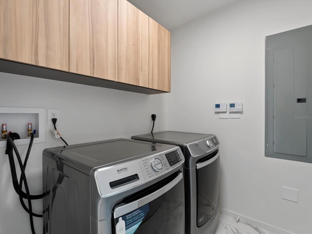 1020 Sunset Point Road, Unit 213 Clearwater, FL 33755 - Photo 39 of 42 a utility room with dryer and washer