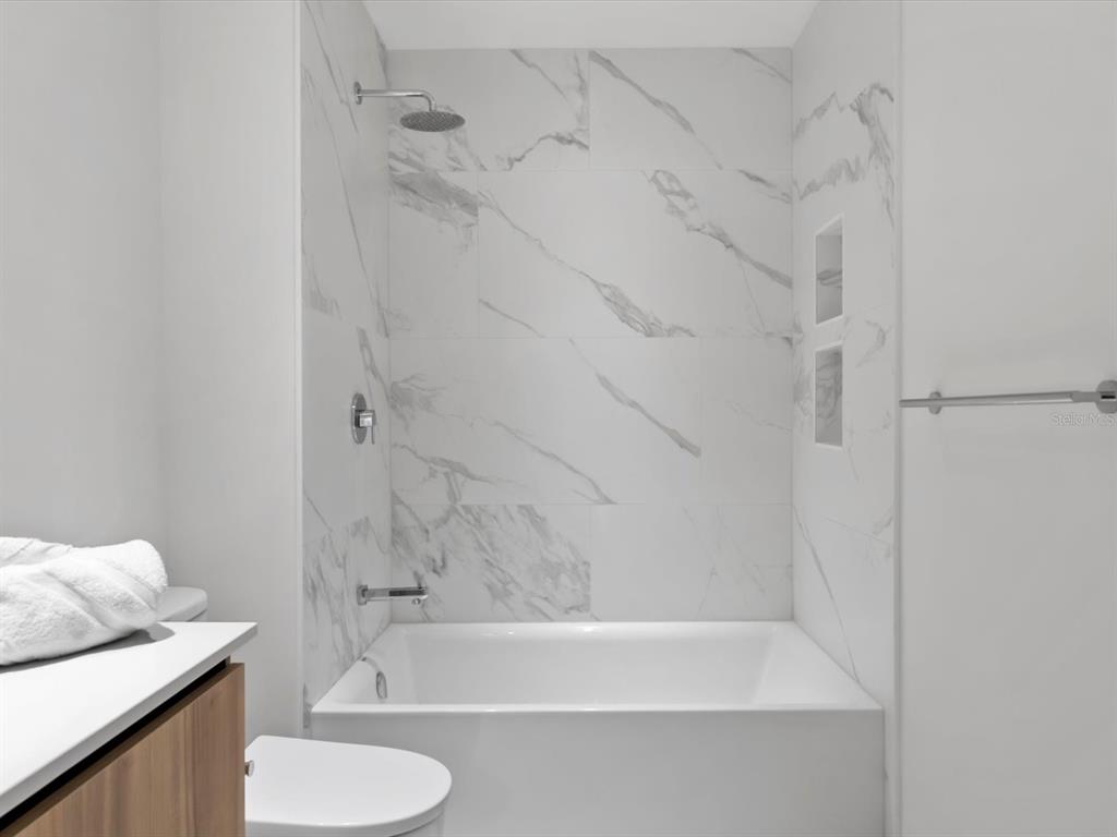 1020 Sunset Point Road, Unit 213 Clearwater, FL 33755 - Photo 42 of 42 a bathroom with a sink and a bathtub