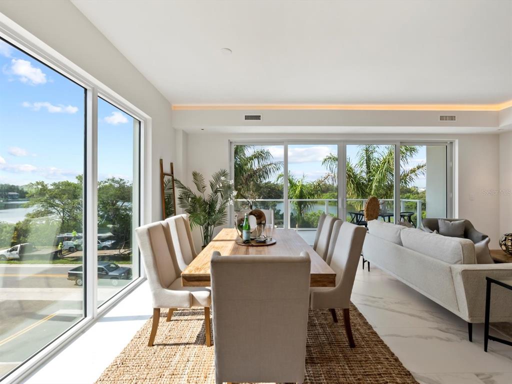 1020 Sunset Point Road, Unit 213 Clearwater, FL 33755 - Photo 6 of 42 a dining room with furniture window and outside view