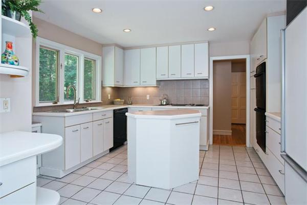 25 Lancaster Road Newton, MA 02458 - Photo 6 of 10 a kitchen with a sink cabinets and window