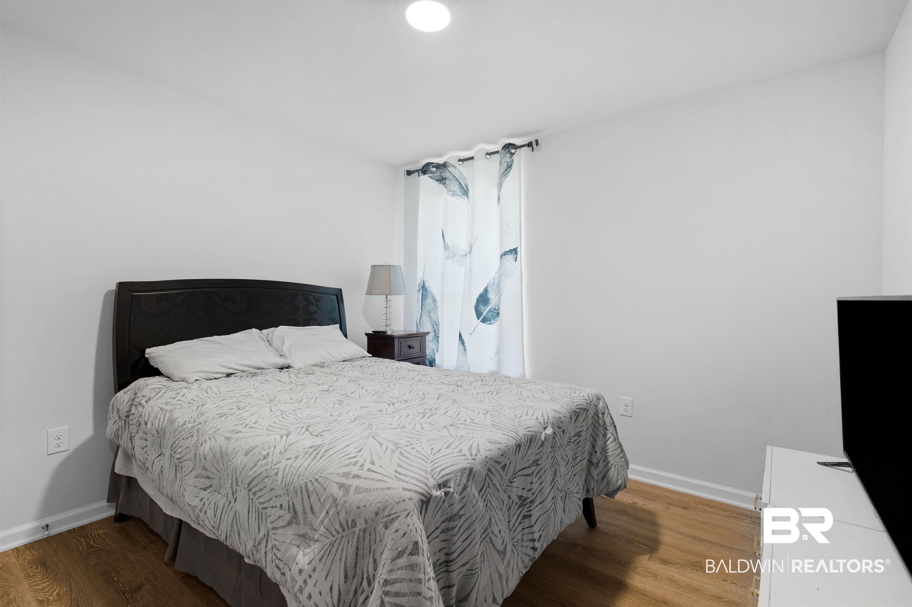10261 Ruffian Route Daphne, AL 36526 - Photo 9 of 28 Bedroom with baseboards and wood finished floors