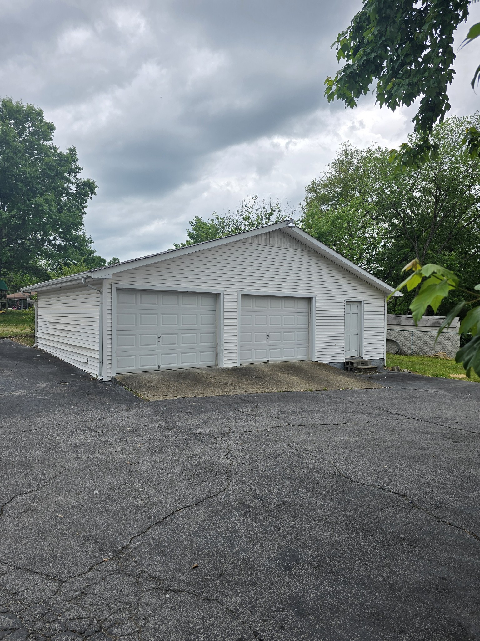 705 Nichols Street Pulaski, TN 38478 - Photo 2 of 7 a view of a house with a yard and garage