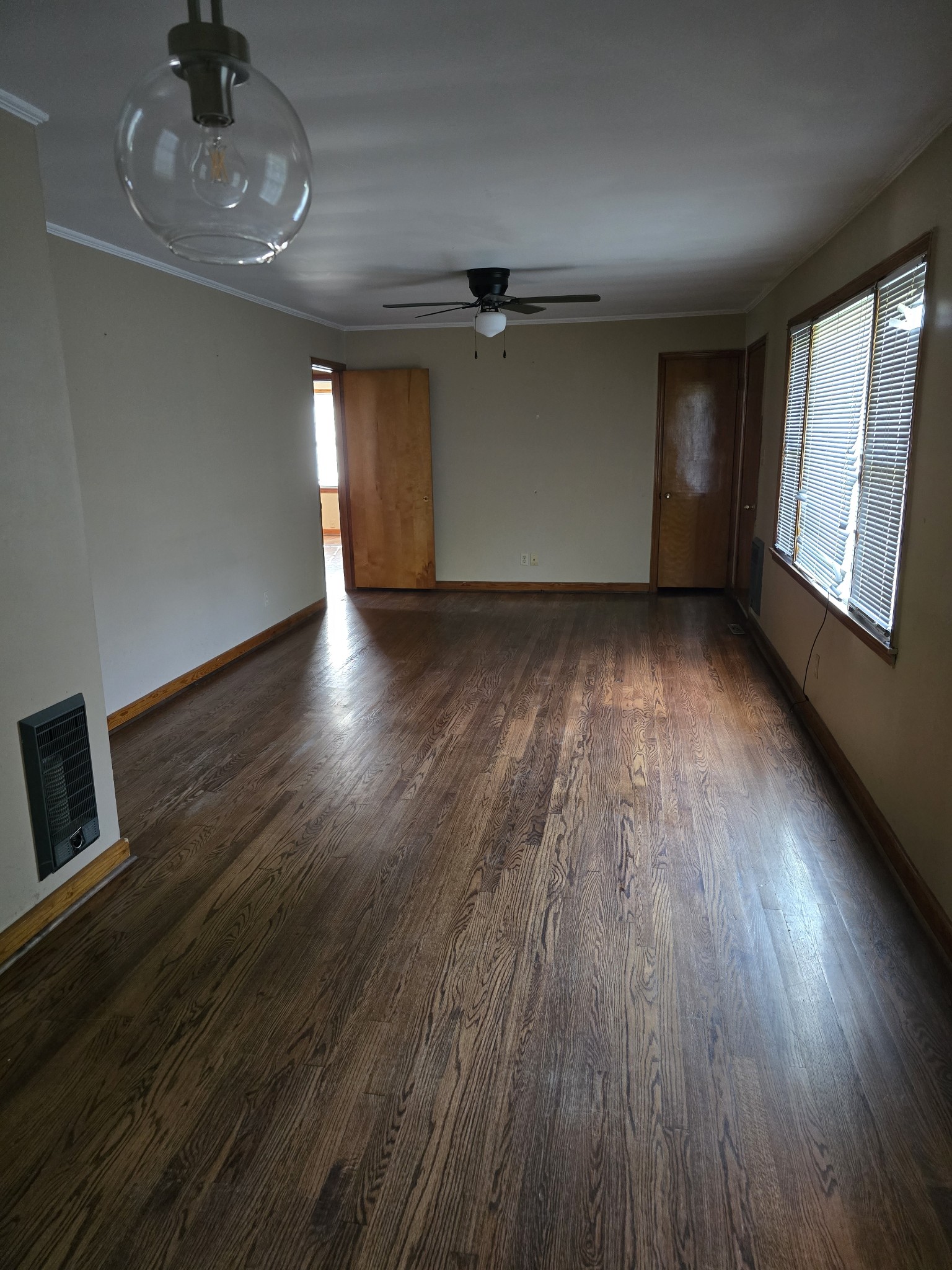 705 Nichols Street Pulaski, TN 38478 - Photo 3 of 7 a view of livingroom with hardwood floor and window