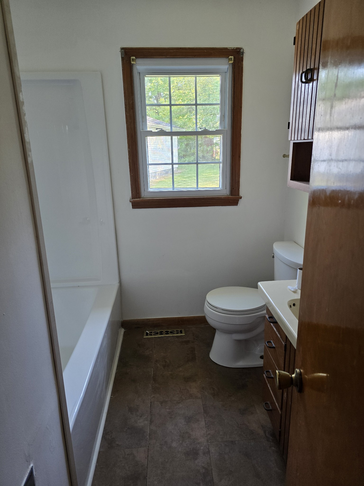 705 Nichols Street Pulaski, TN 38478 - Photo 6 of 7 a bathroom with a toilet and a shower