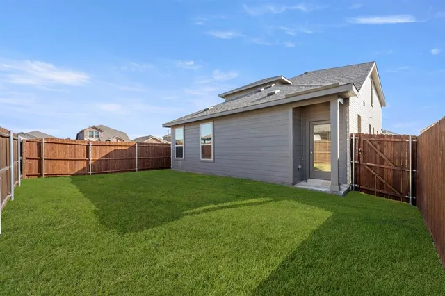 a view of a backyard with potted plants