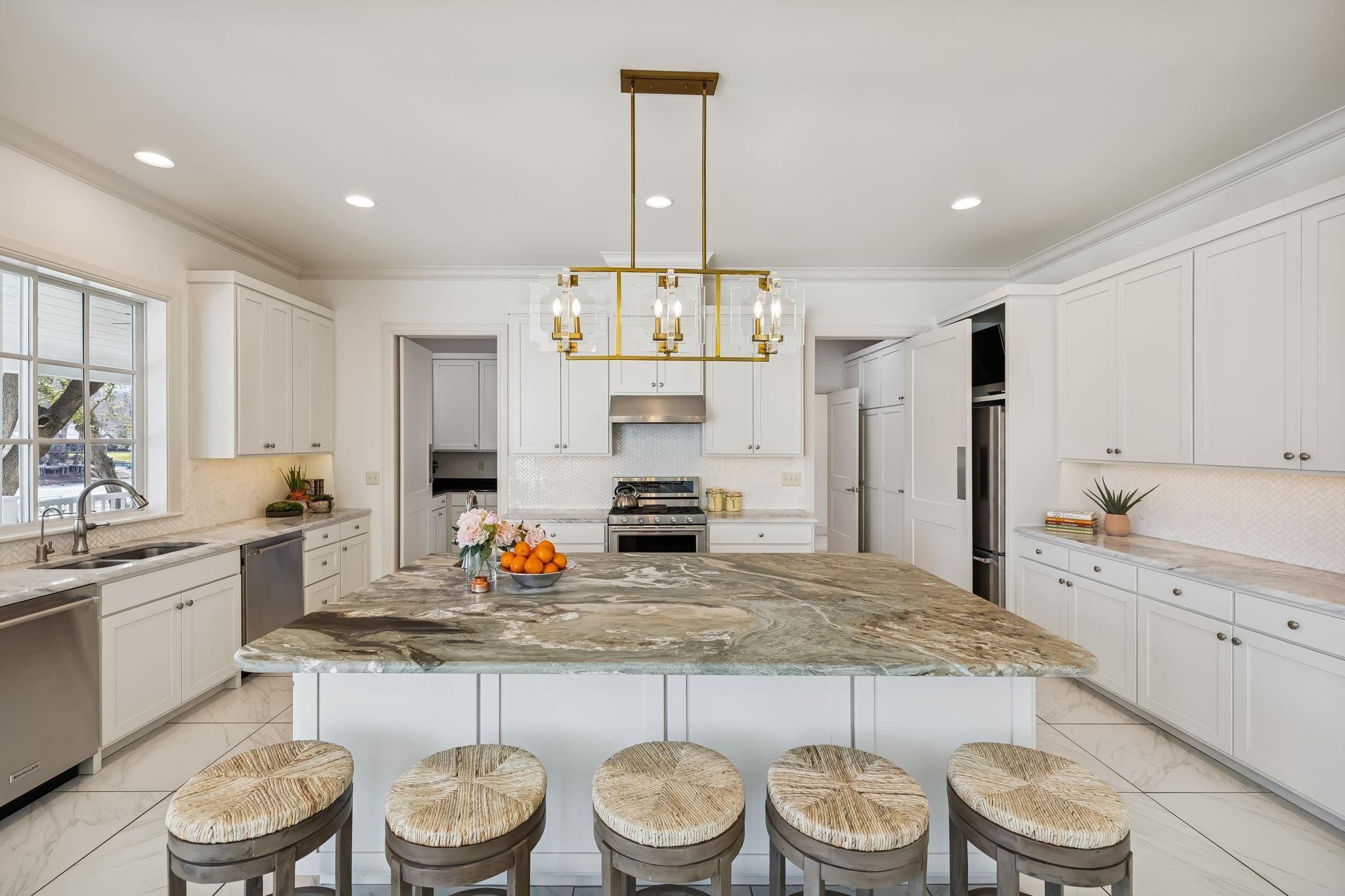 2319 Terminal Loop Road McQueeney, TX 78123 - Photo 14 of 30 a kitchen with a stove a sink and a refrigerator