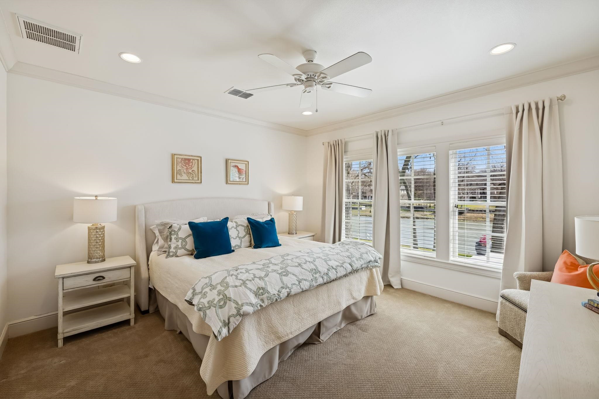 2319 Terminal Loop Road McQueeney, TX 78123 - Photo 16 of 30 a bedroom with a large bed and a large window