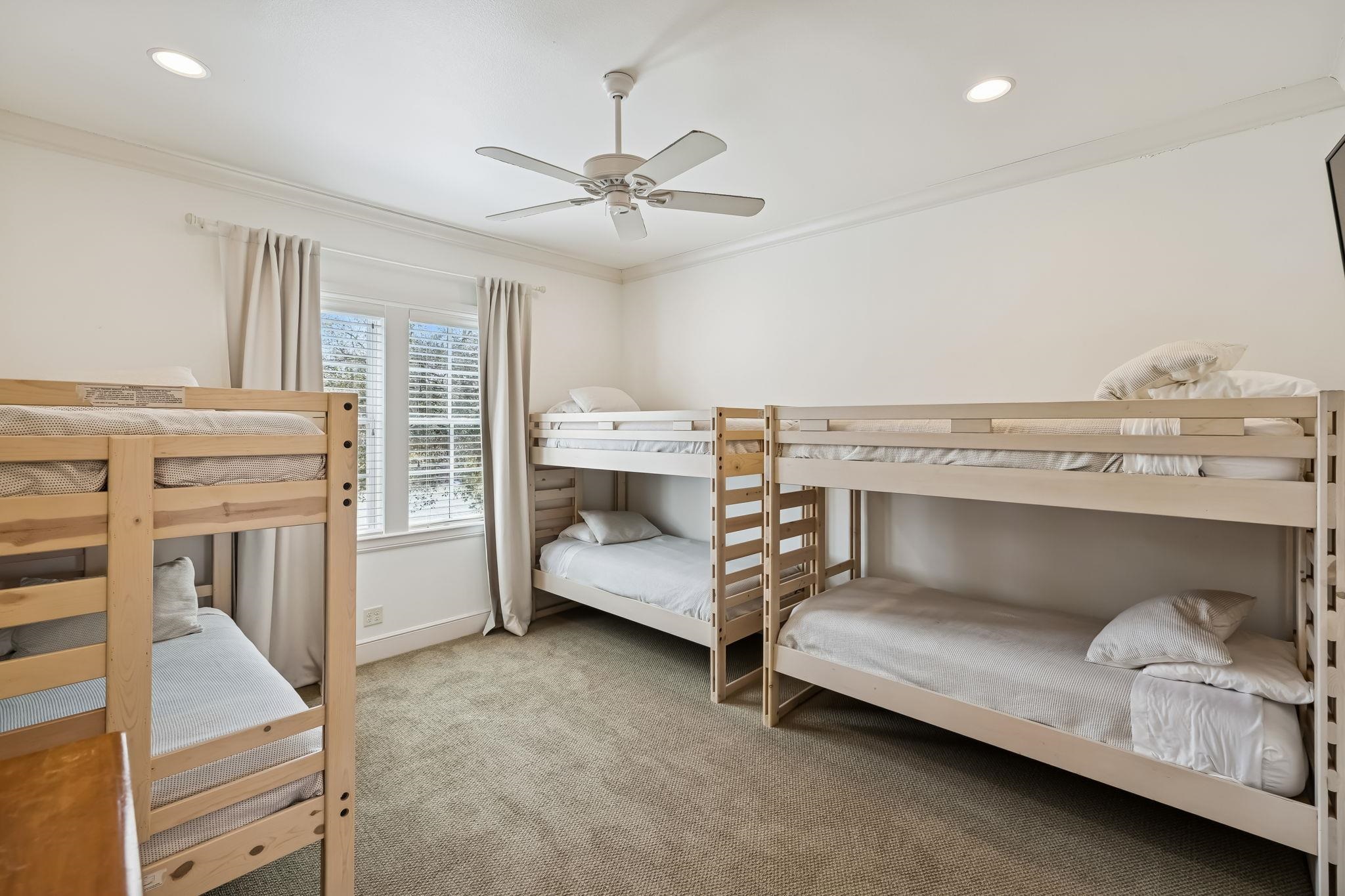 2319 Terminal Loop Road McQueeney, TX 78123 - Photo 21 of 30 a spacious bedroom with a bed and a chandelier