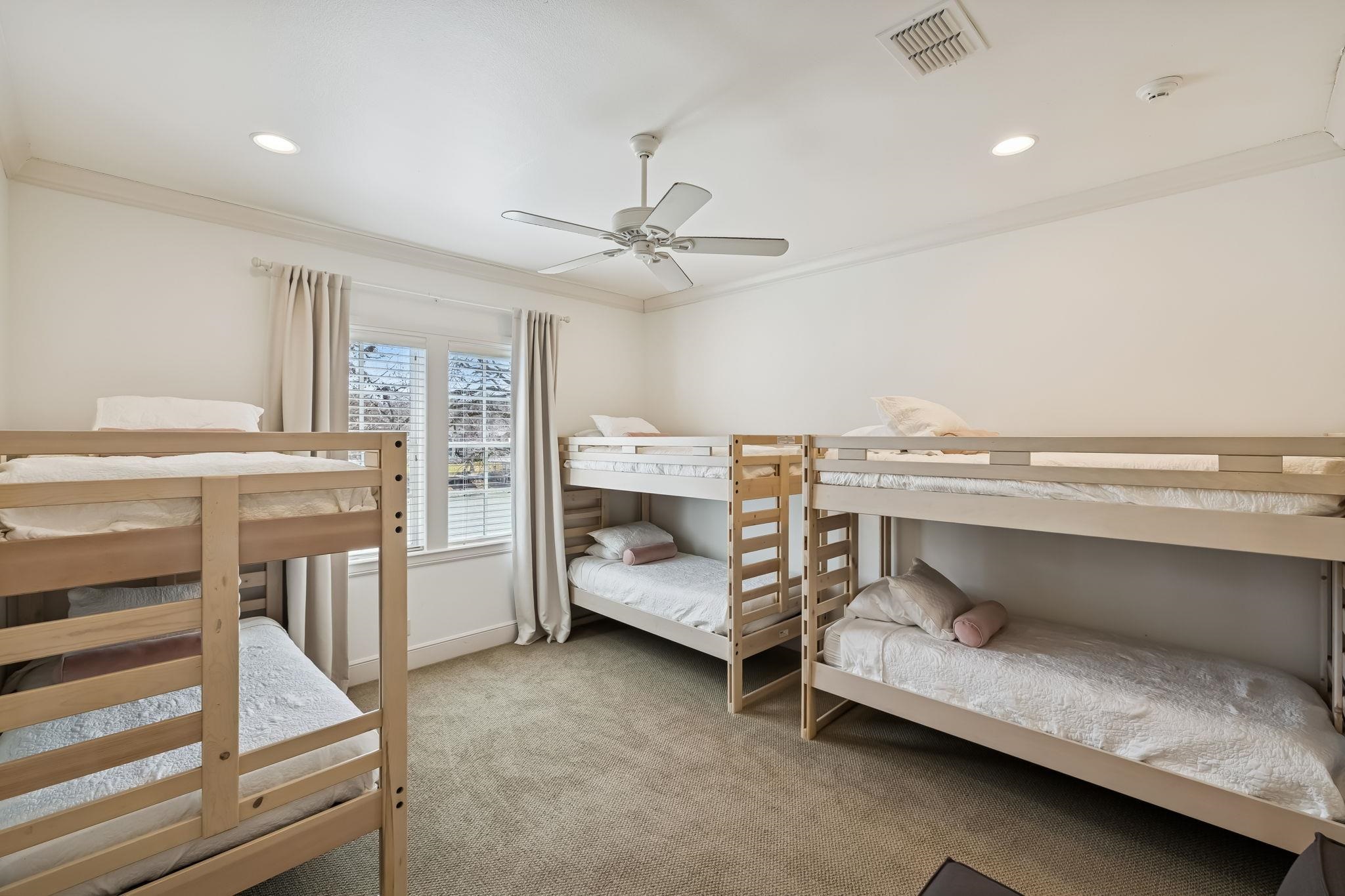 2319 Terminal Loop Road McQueeney, TX 78123 - Photo 22 of 30 a bedroom with a bed and a ceiling fan
