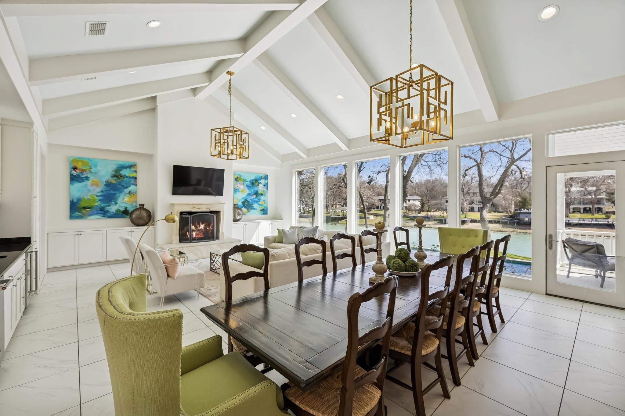 2319 Terminal Loop Road McQueeney, TX 78123 - Photo 10 of 30 a dining room with furniture a flat screen tv and a chandelier