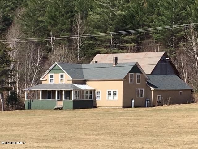 2581 Main Road Stamford, VT 05352 - Photo 2 of 5 a front view of a house with a yard