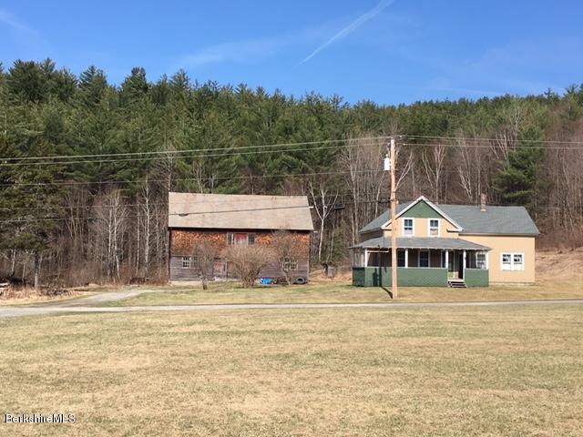 2581 Main Road Stamford, VT 05352 - Photo 4 of 5 a view of a large lake with a mountain in the background
