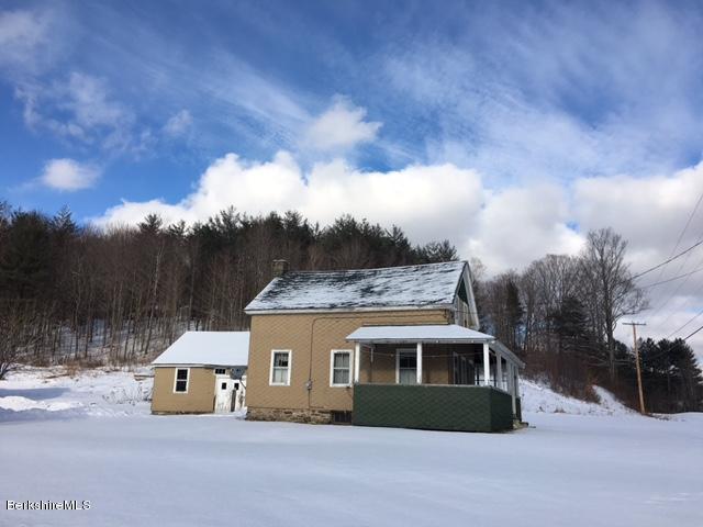 2581 Main Road Stamford, VT 05352 - Photo 5 of 5 a front view of a house with a yard and garage