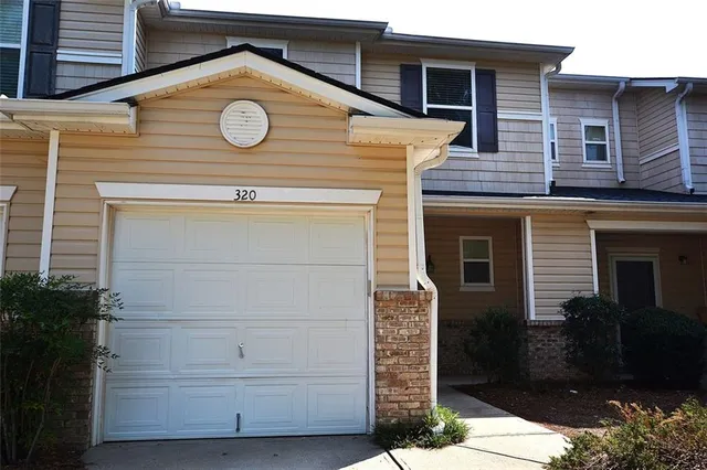 a view of a house with a garage