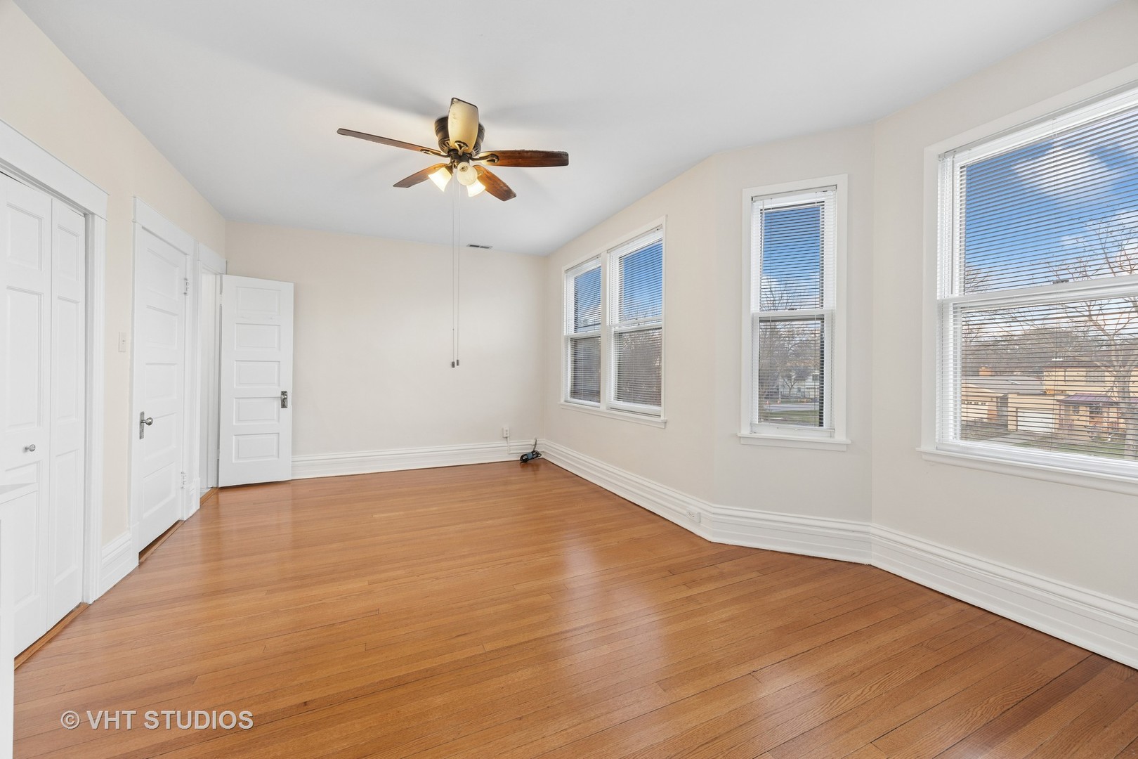 309 Wesley Avenue Oak Park, IL 60302 - Photo 29 of 56 a view of an empty room with wooden floor and a window
