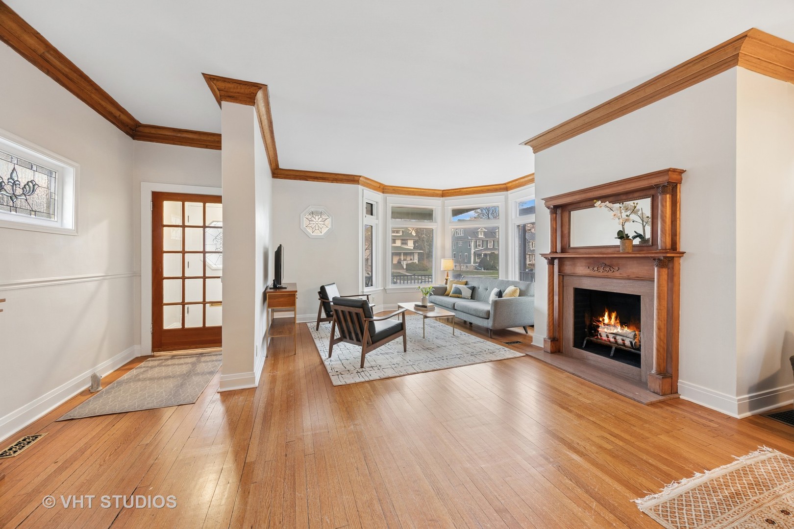 309 Wesley Avenue Oak Park, IL 60302 - Photo 3 of 56 a living room with furniture and a fireplace