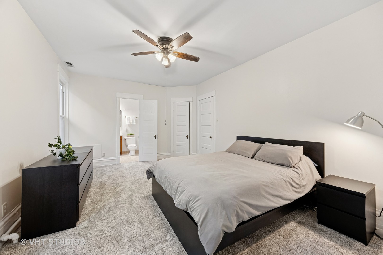 309 Wesley Avenue Oak Park, IL 60302 - Photo 32 of 56 a bedroom with a bed and a chandelier
